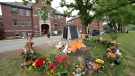 A memorial is seen outside the residential school in Kamloops, B.C., Sunday, June, 13, 2021. THE CANADIAN PRESS/Jonathan Hayward