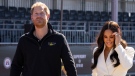 Prince Harry and Meghan Markle, Duke and Duchess of Sussex at the Invictus Games in The Hague, Netherlands, Sunday, April 17, 2022. (AP Photo/Peter Dejong, File)