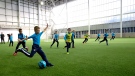 Members of a youth team play a game at Manchester City's new City Football Academy Monday Dec. 8, 2014. (AP / Jon Super)